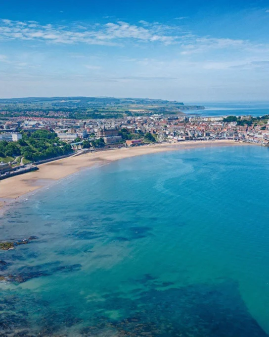 A UK beach with clear blue water
