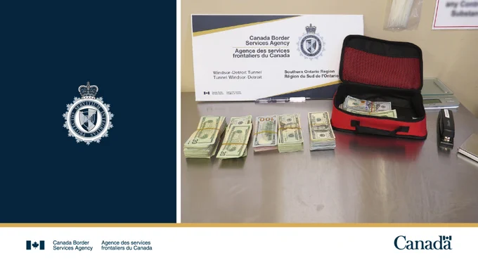 Bundles of cash on a table with a red bag.