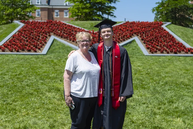 A Terp graduate poses with their mother at The M