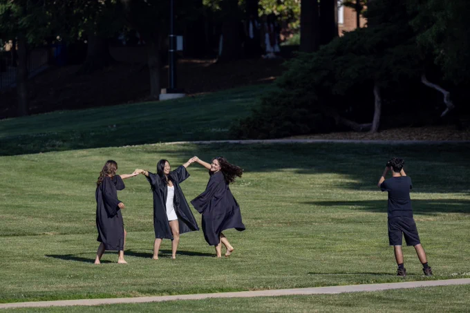 A trio of Terp graduates celebrate on McKeldin Mall