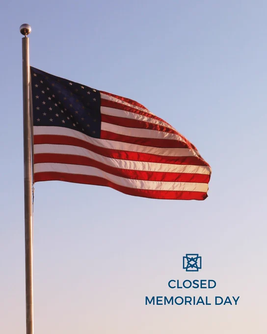An American flag on a flagpole against a clear sky. Text reads: "Closed Memorial Day."