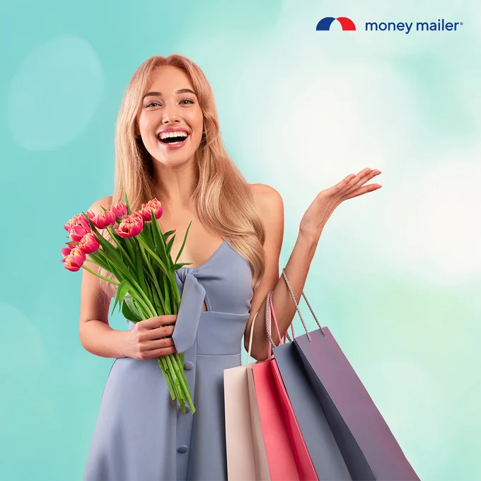 Woman in a blue dress holding pink tulips and multiple shopping bags against a soft blue background with Money Mailer logo.