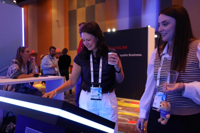Two women engaging with an activation at the Microsoft AI Tour
