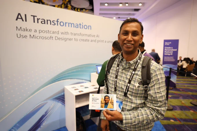 A man holding a postcard featuring an avator of himself at the Microsoft AI Tour
