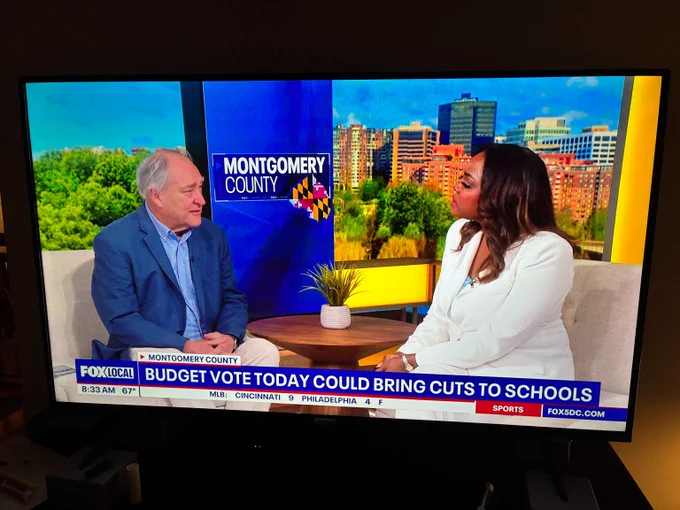 Two news anchors discuss Montgomery County budget vote and potential school cuts on a morning FOX Local broadcast.