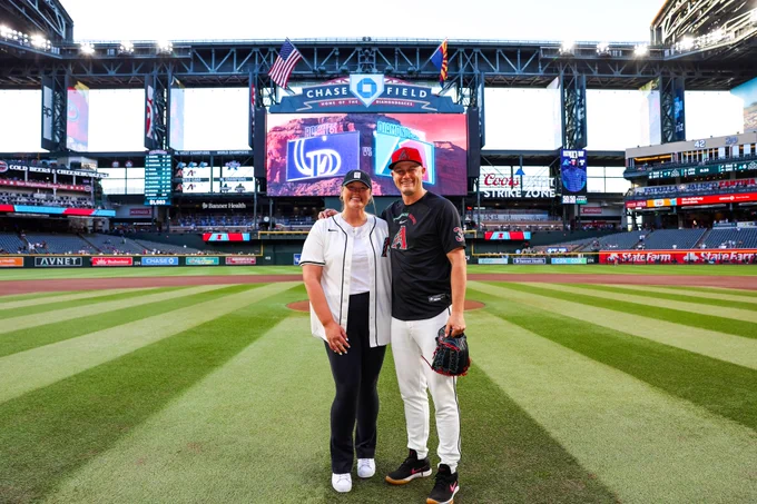 Dallas Escobedo Magee poses for a photo with Paul Sewald after throwing out the ceremonial first pitch. 