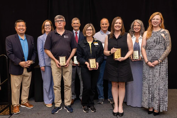 President Choi and Vice President for Human Resources Marsha Fischer with the six Chancellor’s Outstanding Staff Award winners and Staff Advisory Council Chair Kelsie Gibler