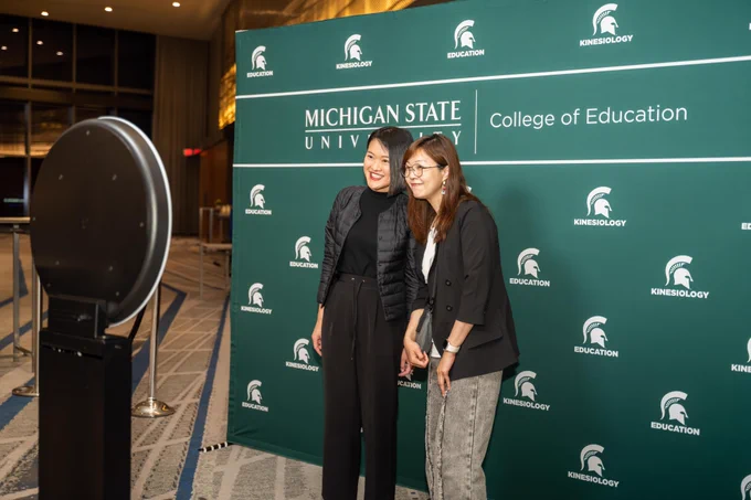 Two Spartans pose for a photo