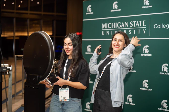 Two Spartans pose for a photo
