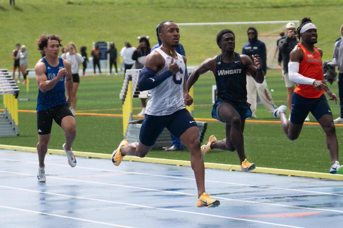 Action photo of Victor Smith competing in the 100m dash.