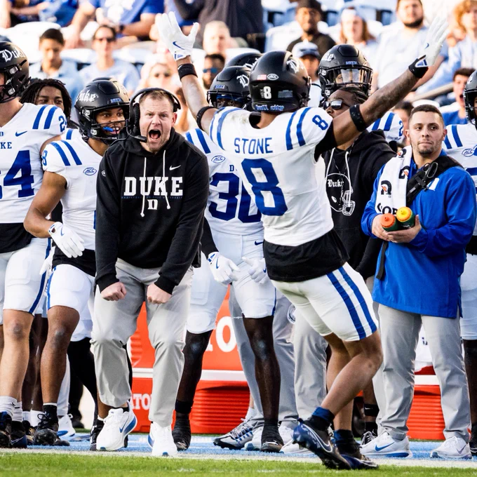 Duke safety DaShawn Stone celebrates a pass breakup as defensive coordinator Jonathan Patke yells in celebration. 