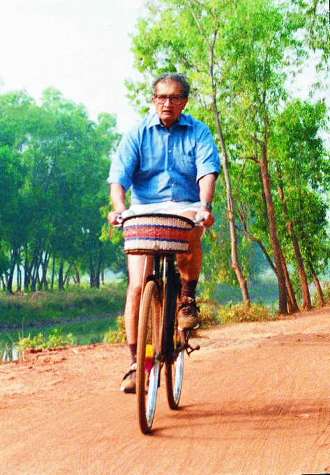 Amartya Sen riding a bike
