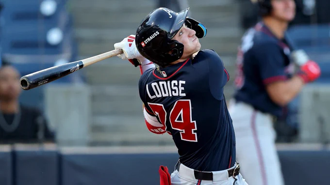 Alex Lodise hits in navy Braves jersey