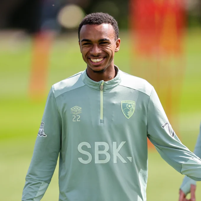 Junior Kroupi smiles in AFC Bournemouth in training.