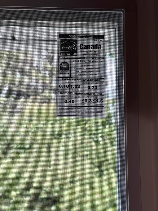 Close-up of ENERGY STAR certified replacement window label in Winnipeg home to highlight energy-efficient custom windows built for Manitoba weather.