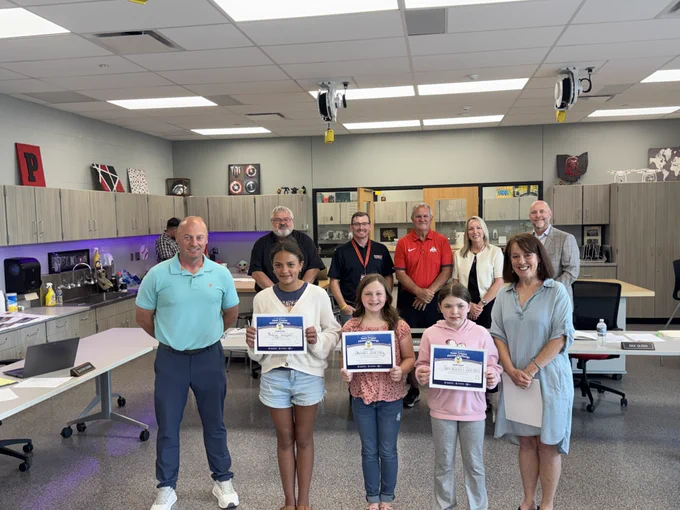 students being recognized at BOE meeting