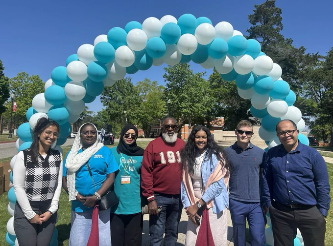(l to r): Eliz Celik '25; Ehsan Abdalla, assistant professor of public health, director of analytics, Tuskegee University; Isra Elhussin, assistant professor of biology, Tuskegee University; Dr. James Harris; Jo Shuford-Guice, NP; Christopher Biloski '25; Iman Hassani, assistant professor of chemica