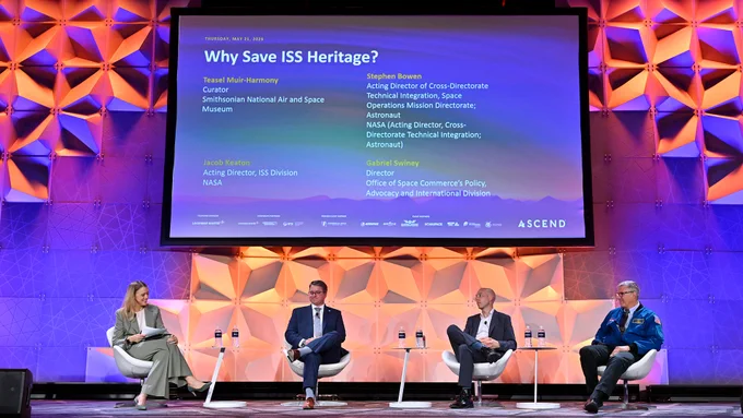 Smithsonian curator Teasel Muir-Harmony (at left) moderates a panel on "Why Save ISS Heritage" with Jacob Keaton, NASA ISS acting director; Gabriel Swiney, director of the Office of Space Commerce's Policy, Advocacy and International Division; and NASA astronaut Stephen Bowen during the ASCEND conference, May 21, 2026, in Washington, DC. (AIAA/David Becker/PWHL)