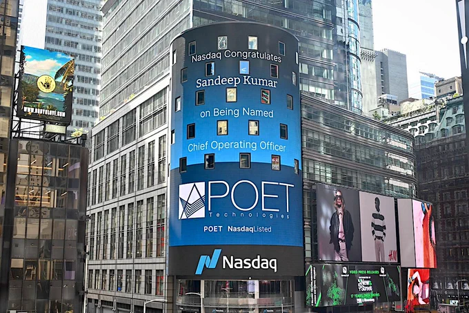 The Nasdaq stock exchange places news of POET Technologies' hiring of Sandeep Kumar as COO on its Manhattan billboard.