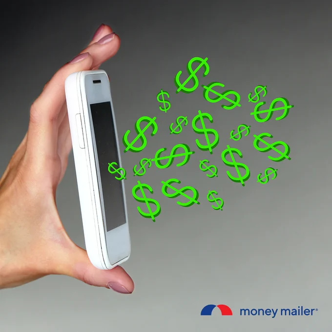 Hand holding a white smartphone with green dollar signs floating out, symbolizing mobile money.