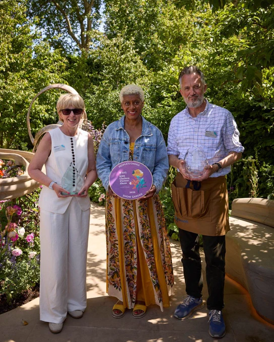 Our CEO Caroline Rassell, Arit Anderson and Paul Jackson-Clark are standing in our Chelsea garden holding the People's Choice Award 