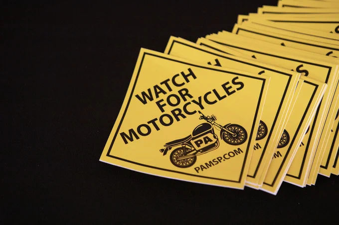 Yellow diamond stickers remind you to watch for motorcycles in Pennsylvania.