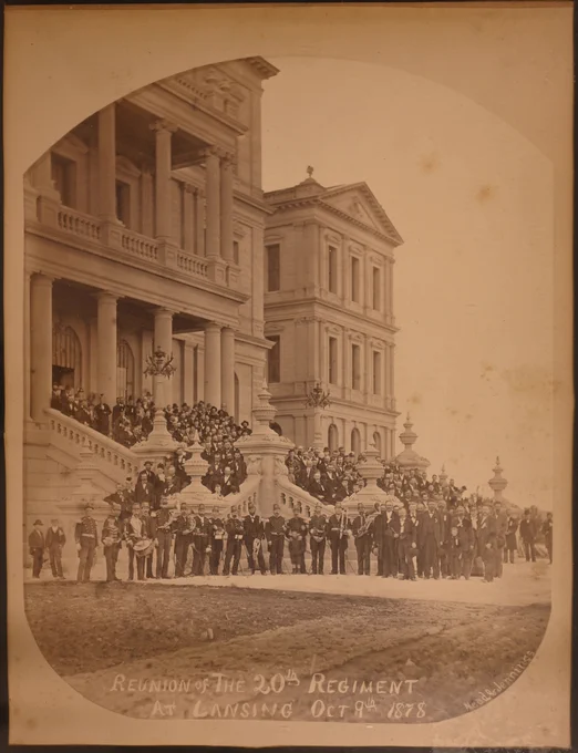 Historic 1878 photograph of the 20th Infantry Regiment reunion gathered on the steps of the newly built Michigan State Capitol in Lansing.