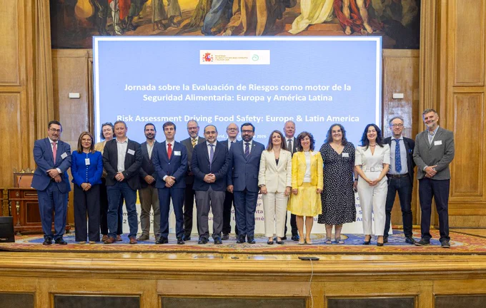 group photo of conference participants on stage.