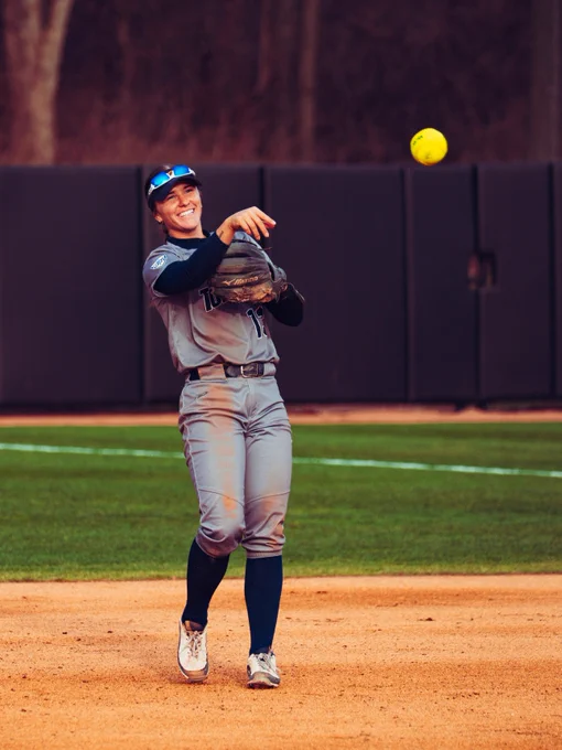 Payton Pudlowski smiling while throwing the ball.