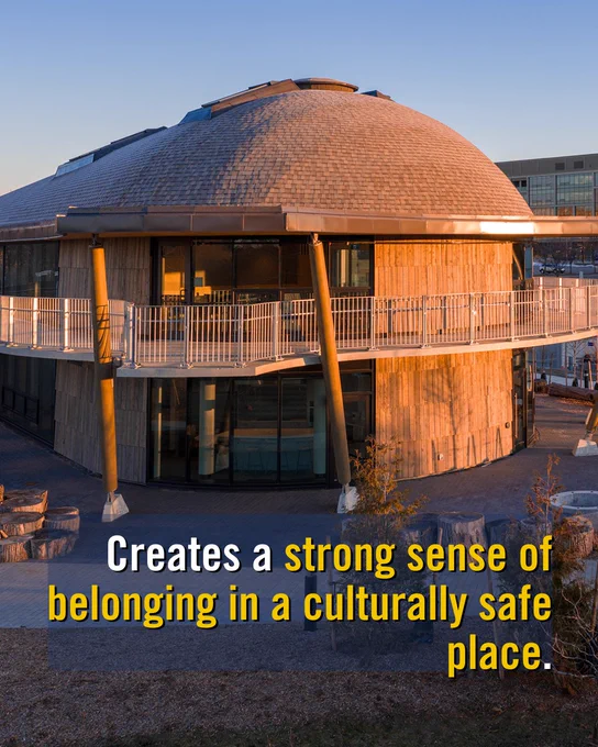 The Indigenous House is shown in warm, sunset lighting. The structure includes a circular balcony. Text at the bottom reads: "Creates a strong sense of belonging in a culturally safe place."
