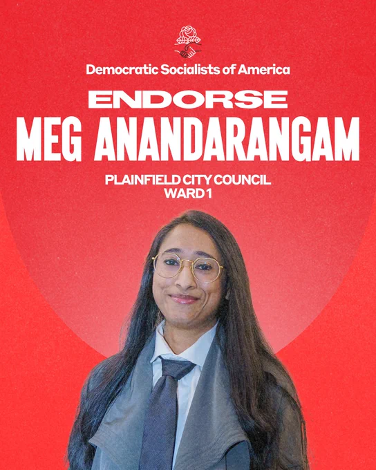 Democratic Socialists of America endorse Meg Anandarangam, Plainfield City Council Ward 1. Photo of Meg, an Indian-American woman wearing a white button-down shirt, blue-grey tie, and grey jacket. She has gold glasses and long black hair.