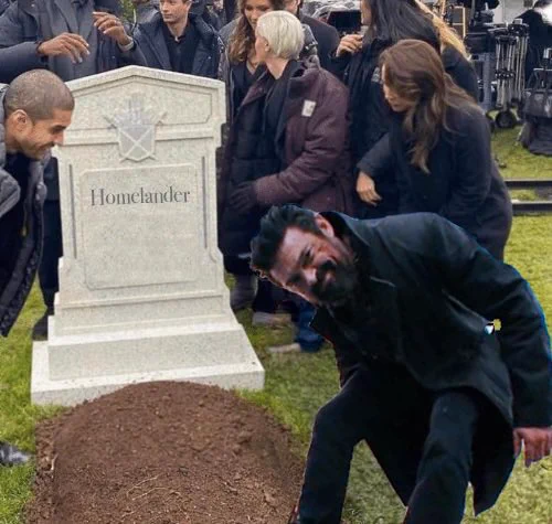 Butcher leaning over and smiling devilishly at the camera. Behind him is a grave that reads “Homelander”