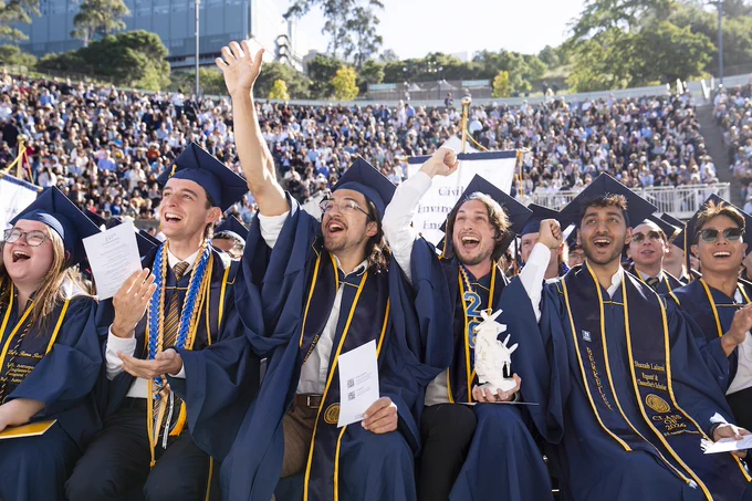 Graduates cheer while seated at the Greek Theatre. (Photo by Adam Lau/UC Berkeley Engineering)
