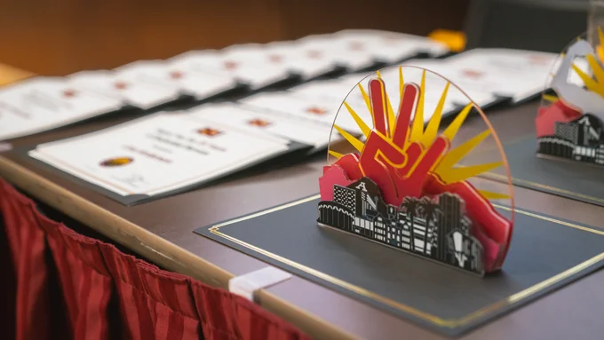 An award sits on a table along with certificates during Arizona State University's FDM Employee Recoginition event in May.  