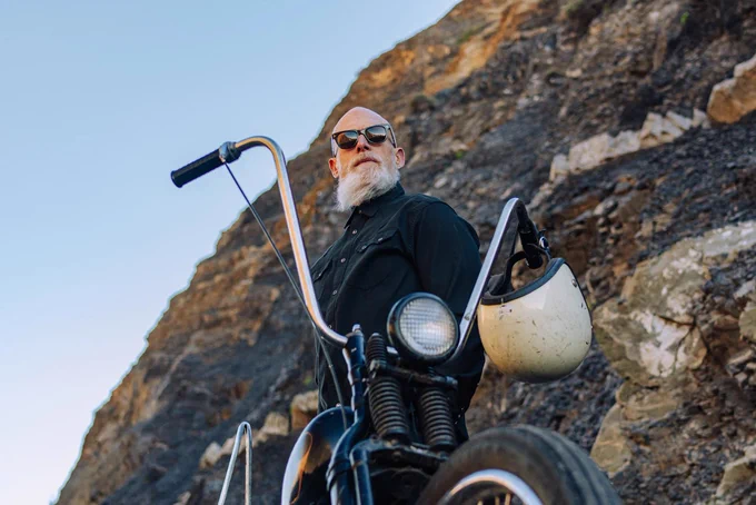 Man with motorcycle wearing SALT. sunglasses
