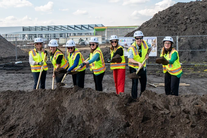 PCL Construction and project partners shovel soil during a children’s museum groundbreaking in Grand Forks, North Dakota, highlighting a key construction milestone.
