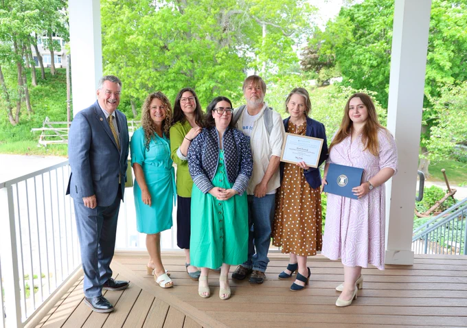 awardees smile with emile howe