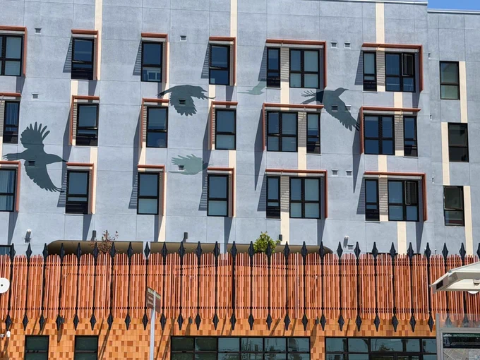 Facade of Flicker, featuring imagery of the Northern Flicker, a bird that is symbolic of Native American culture. 