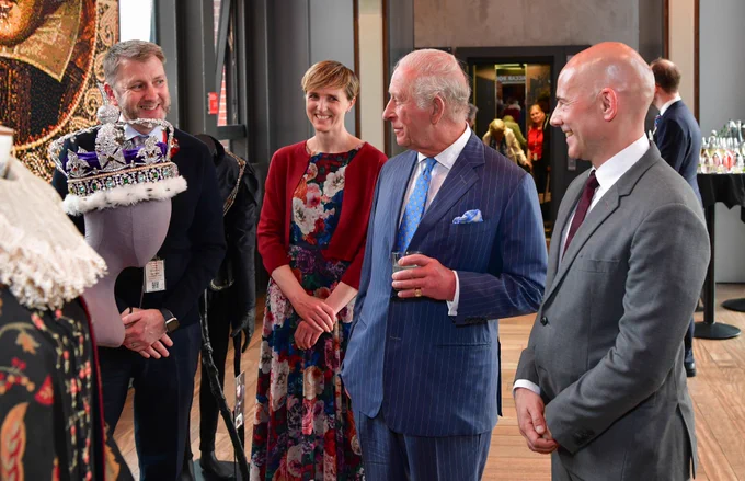 His Majesty the King at the Royal Shakespeare Theatre. HIs Majesty looks at costumes, with RSC Co-Artistic Directors Tamara Harvey and Daniel Evans.