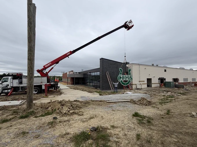 Crane moving Colts sign into position