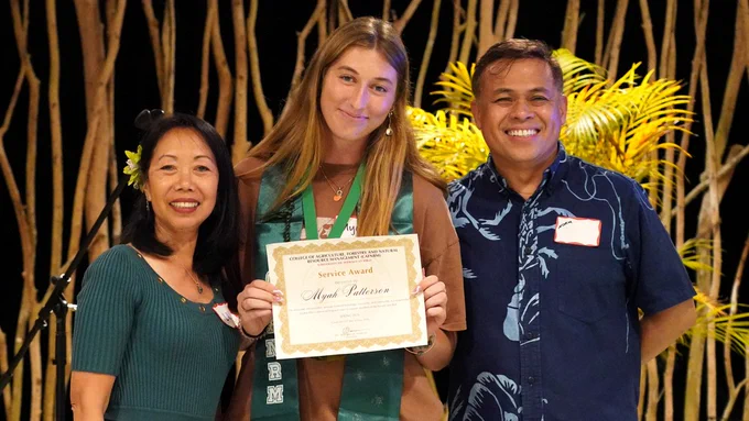 Outstanding Service Award winner Myah Patterson holds her certificate. From left, Agriculture Lecturer Lilia Frey, award-winner Myah Patterson, and Director of the College Norman Arancon. (Photo: Roberto Rodriguez, III/CAFNRM/UH Hilo)