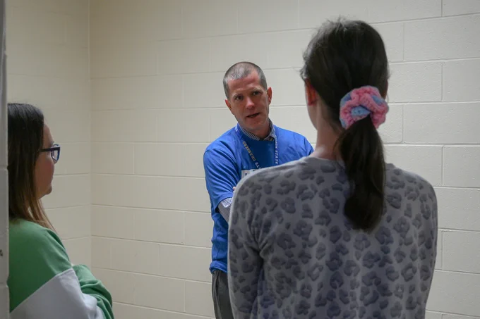 A prospective student and guest speak with an Edison State faculty member during the Career Experience event