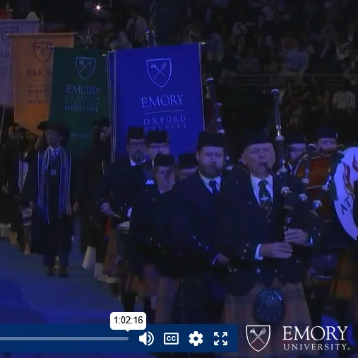 Screengrab of bagpipers leading in the Emory 2026 graduates