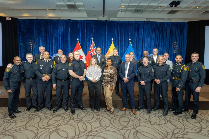 Group picture of individuals in Peel Police uniforms and business attire.