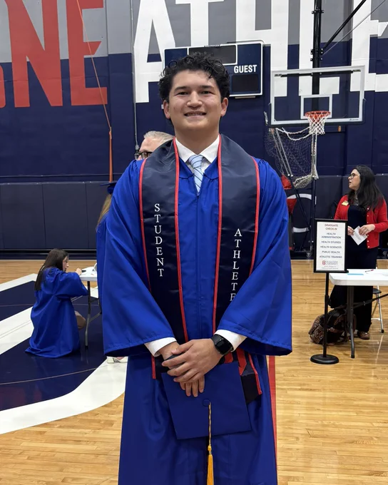Connor Lenz smiling at graduation