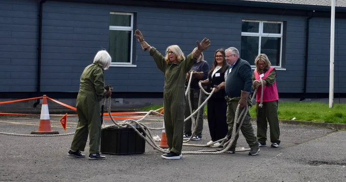 A team of six completing a task.