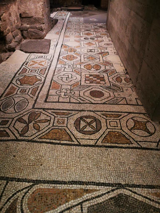 MOSAIC PAVEMENT OF S. REPARATA, C5 CE. DUOMO DI FIRENZE

Large parts of the C5 mosaic pavement survive in the excavations under the floor of S. Maria del Fiore, the cathedral of Florence. The palette is restrained, which kept the costs down, an important consideration given that it was all financed by donors, who paid by the Roman foot. The mosaicists were North African, among the best in the late Roman world, and hired away from home to produce a work of prestige. The designs are purely geometrical, with Solomon's knots, circles, chequerboards, and crosses. 