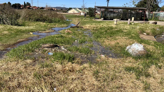 Raw sewage flooding road & park due to poor maintenance