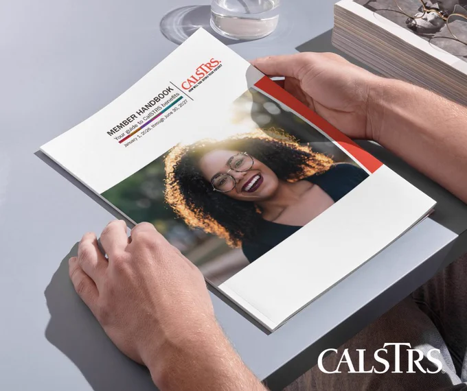 Person holding a CalSTRS Member Handbook with a smiling individual on the cover.