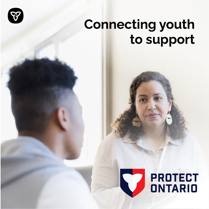 Youth talking to an adult. Image Text: Connecting youth to support.
